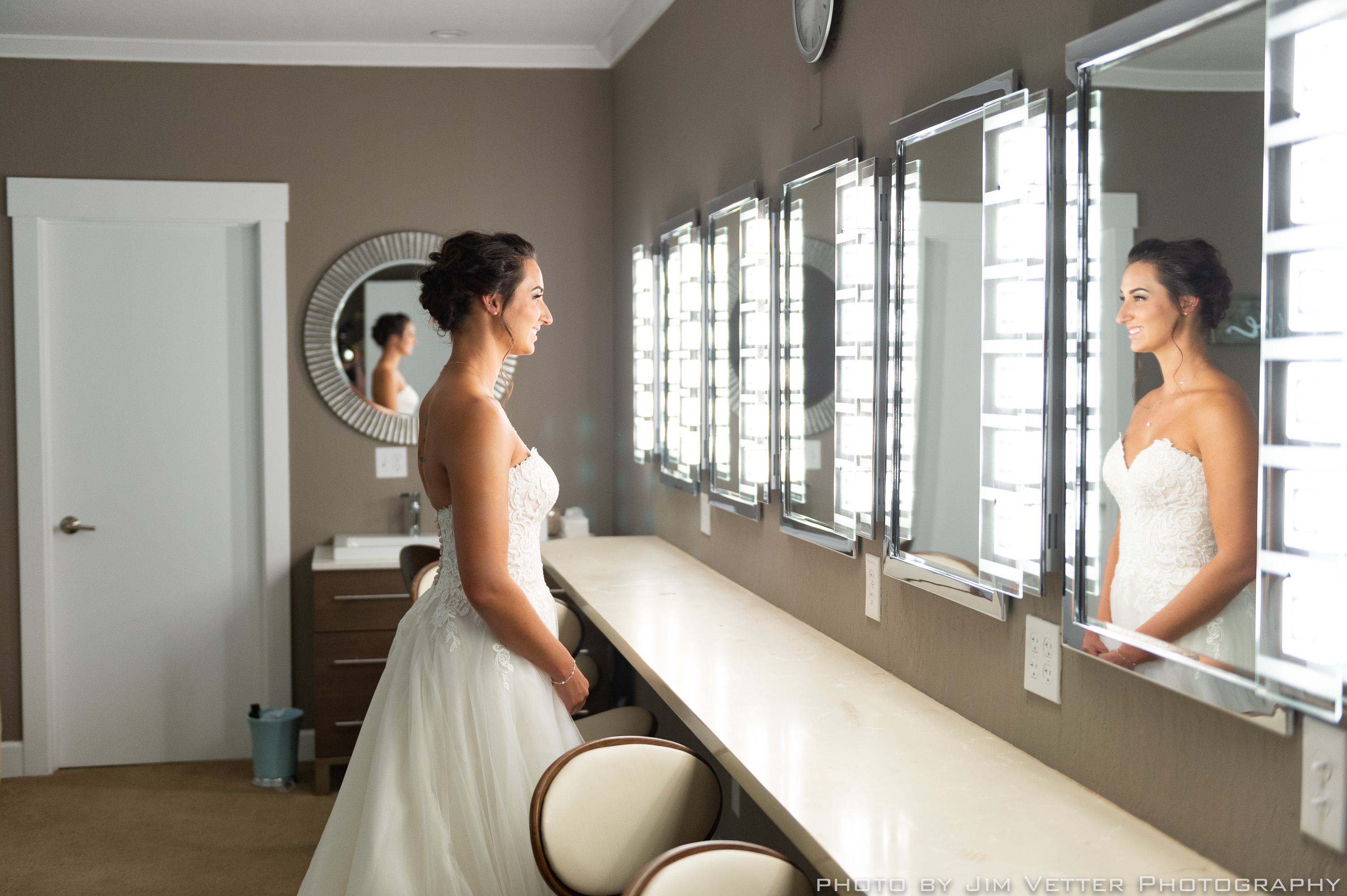bride at mirror in deer park villa bridal cottage