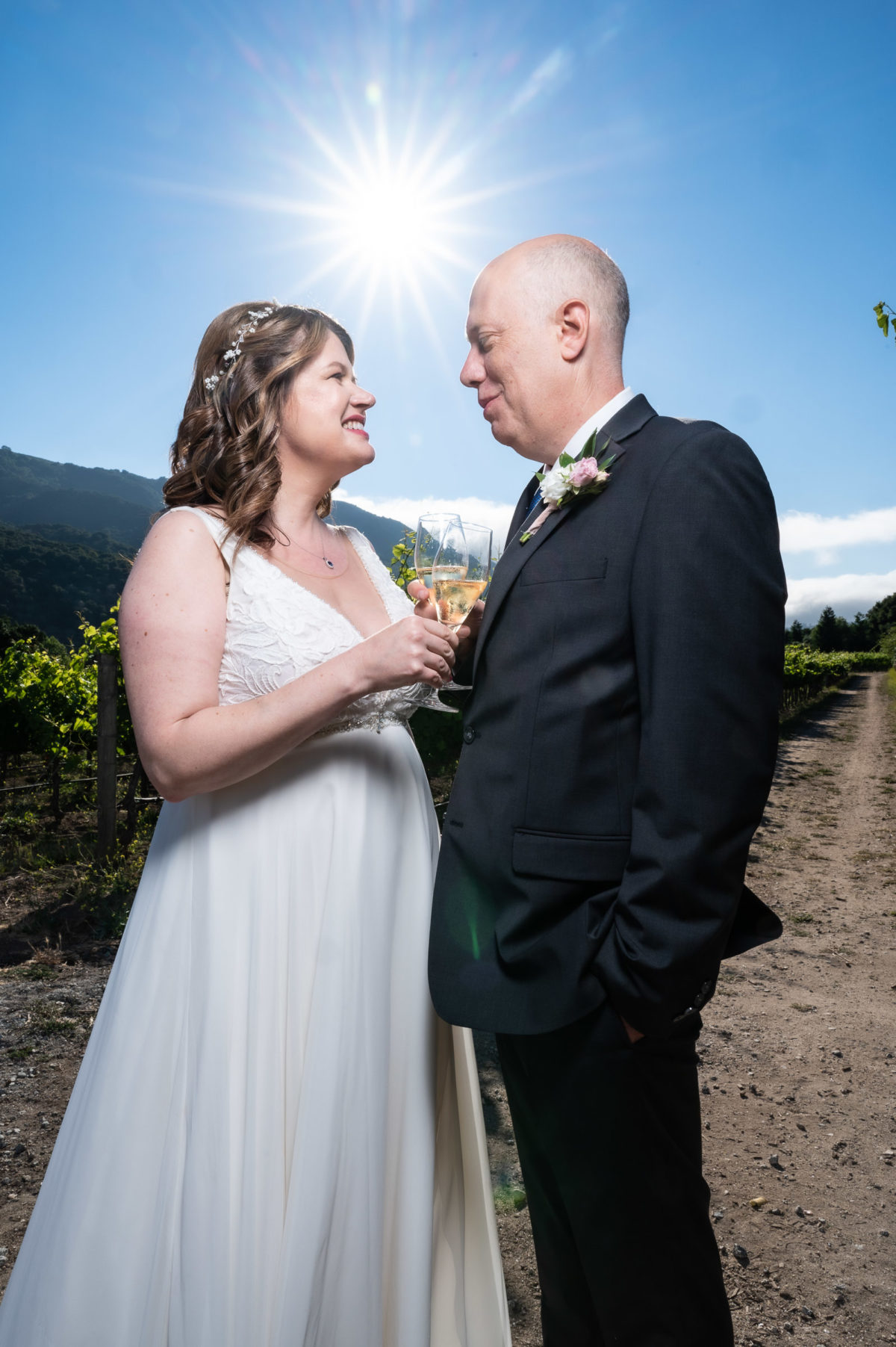 bride and groom in vineyard