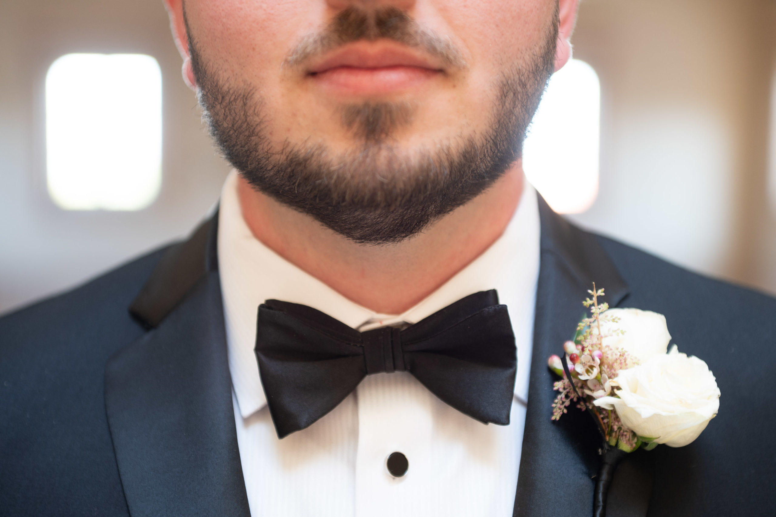 groom closeup of lower face and bowtie