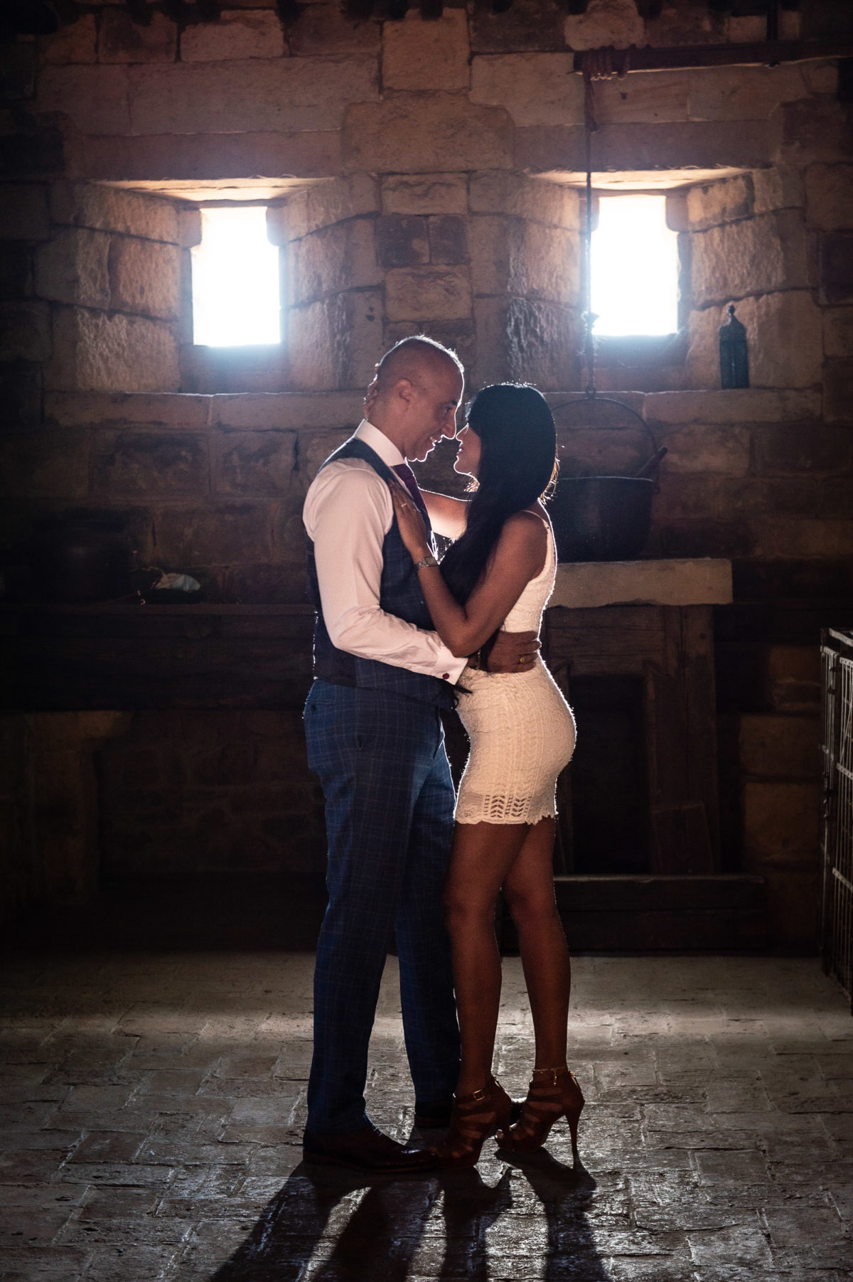 profile of couple backlit in castle