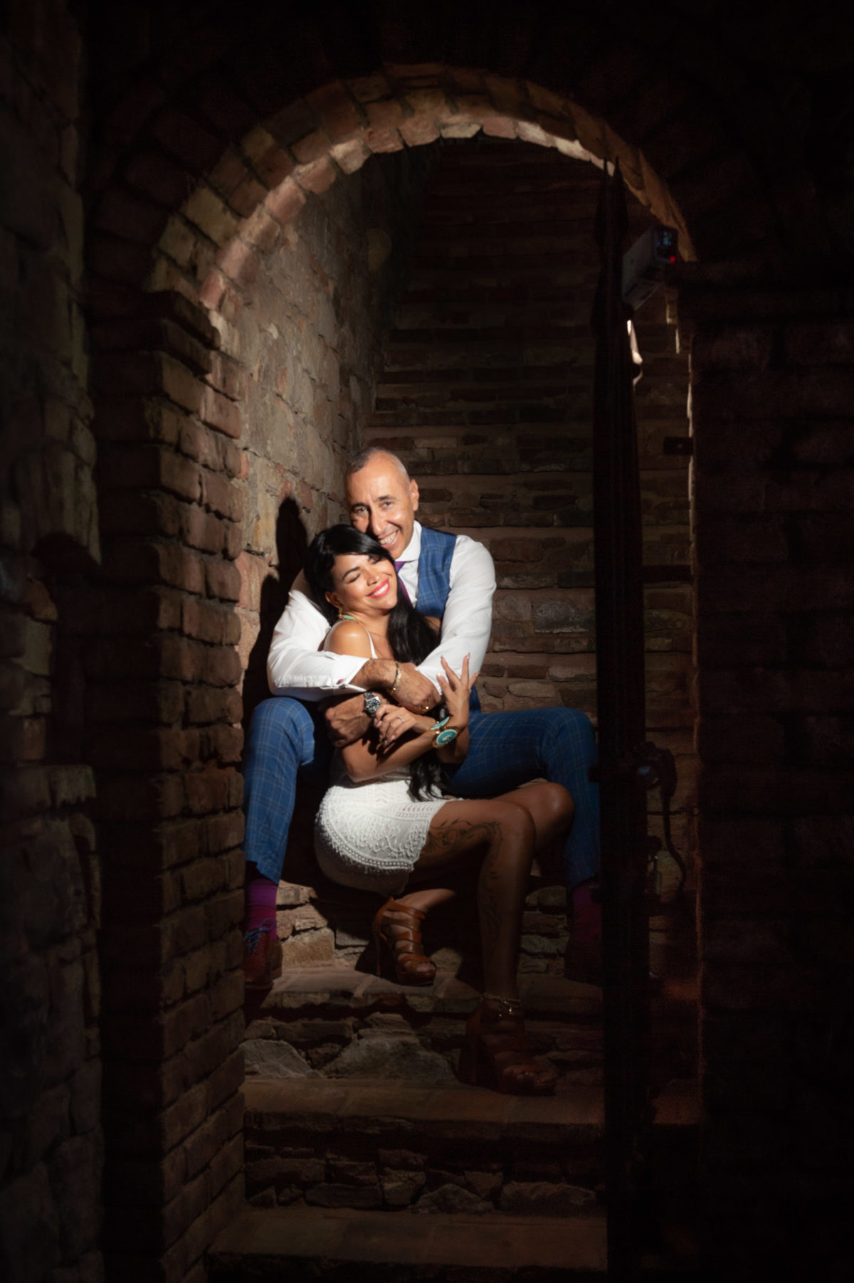 cozy couple on stairway in castle