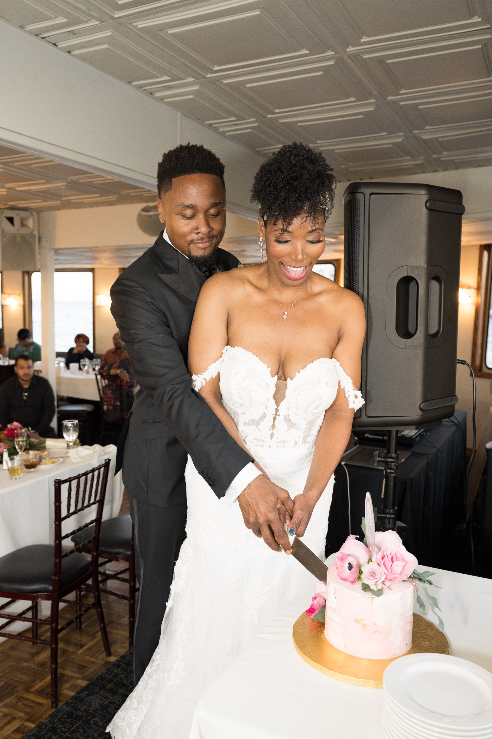 bride & groom cutting cake