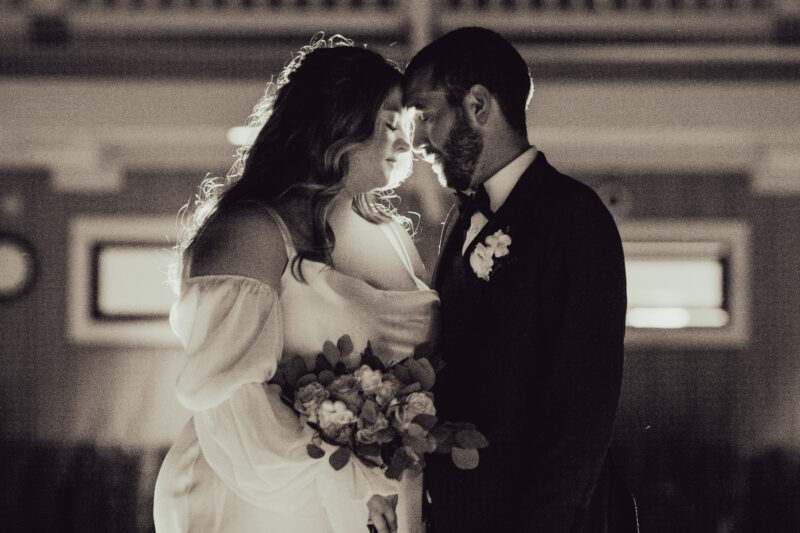 a bride and groom standing next to each other.