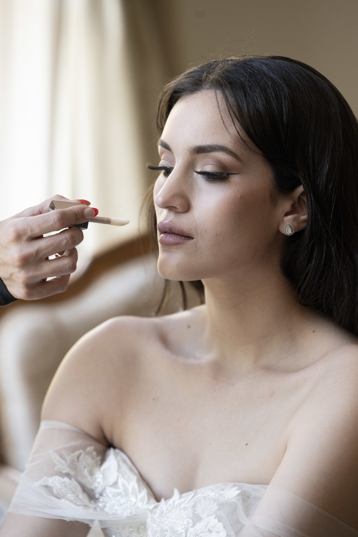 bride getting makeup