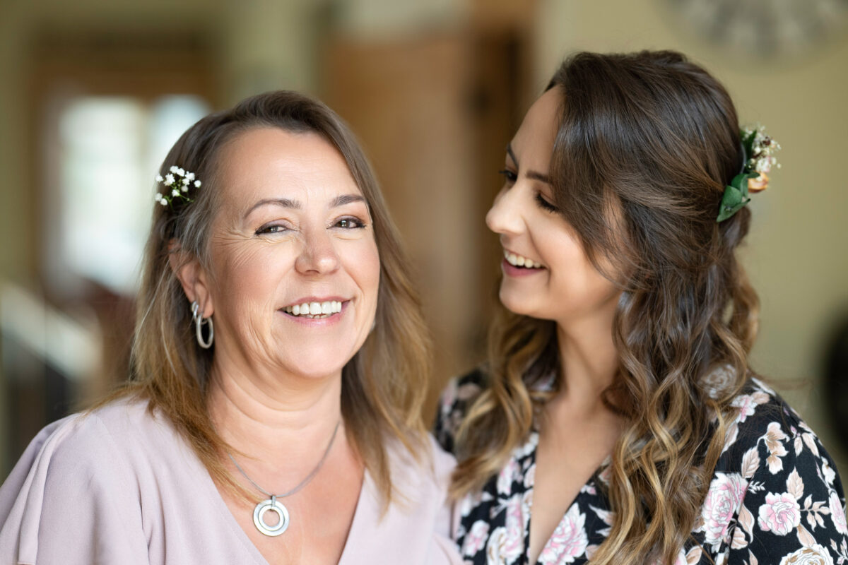 Bride and mother smiling