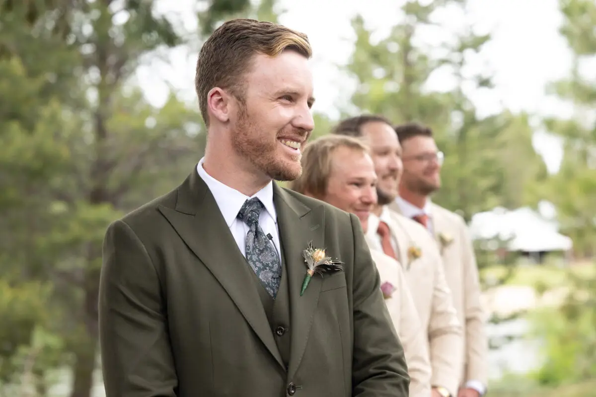 groom watching bride come down aisle