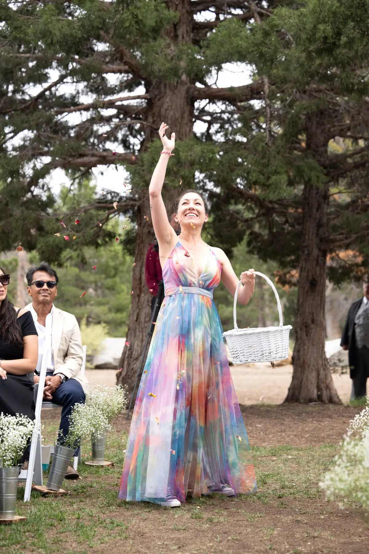 flower girl tossing petals into the air