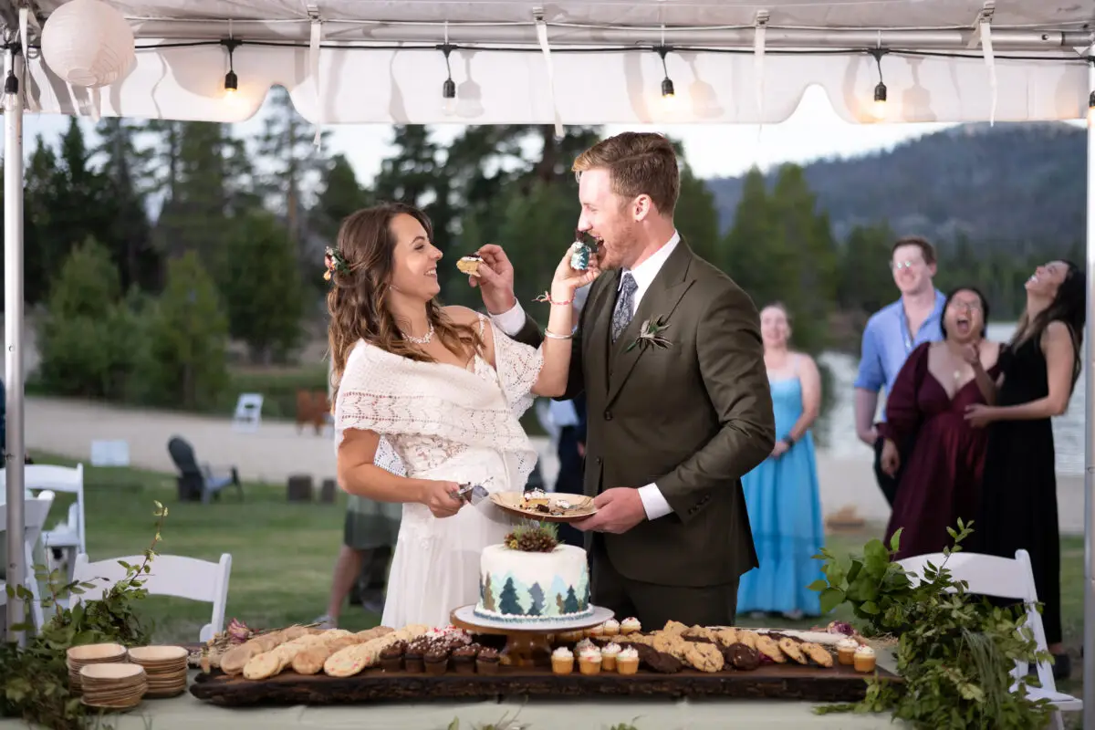 Bride and Groom eating wedding cake