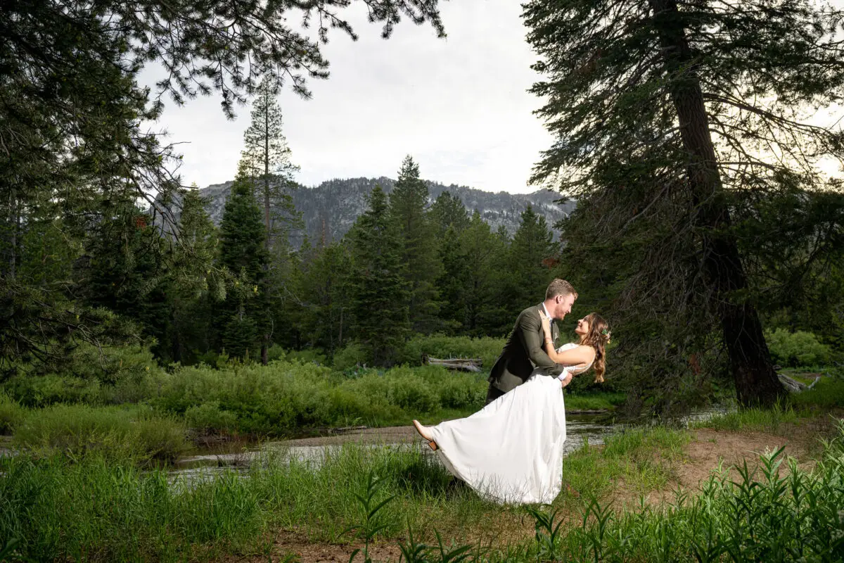 Bride and Groom portrait in woods dipping bride